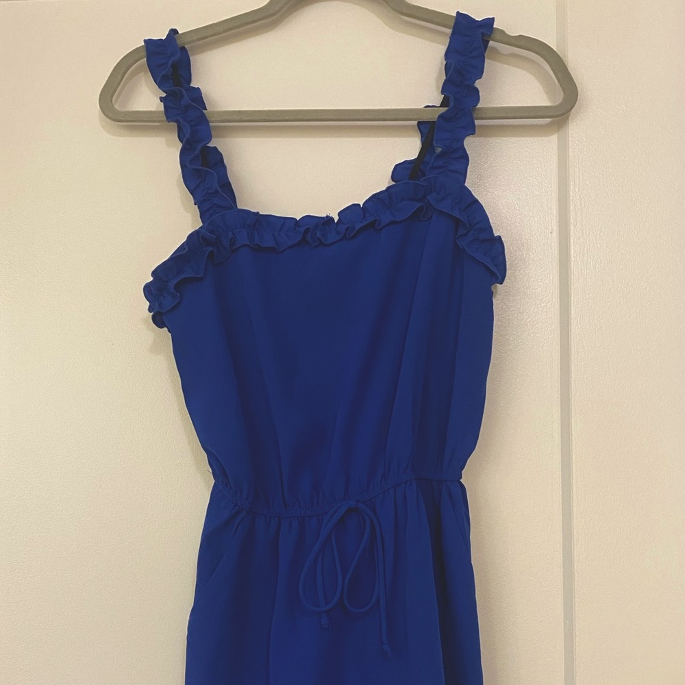 Royal blue romper with ruffle sleeves and waist tie